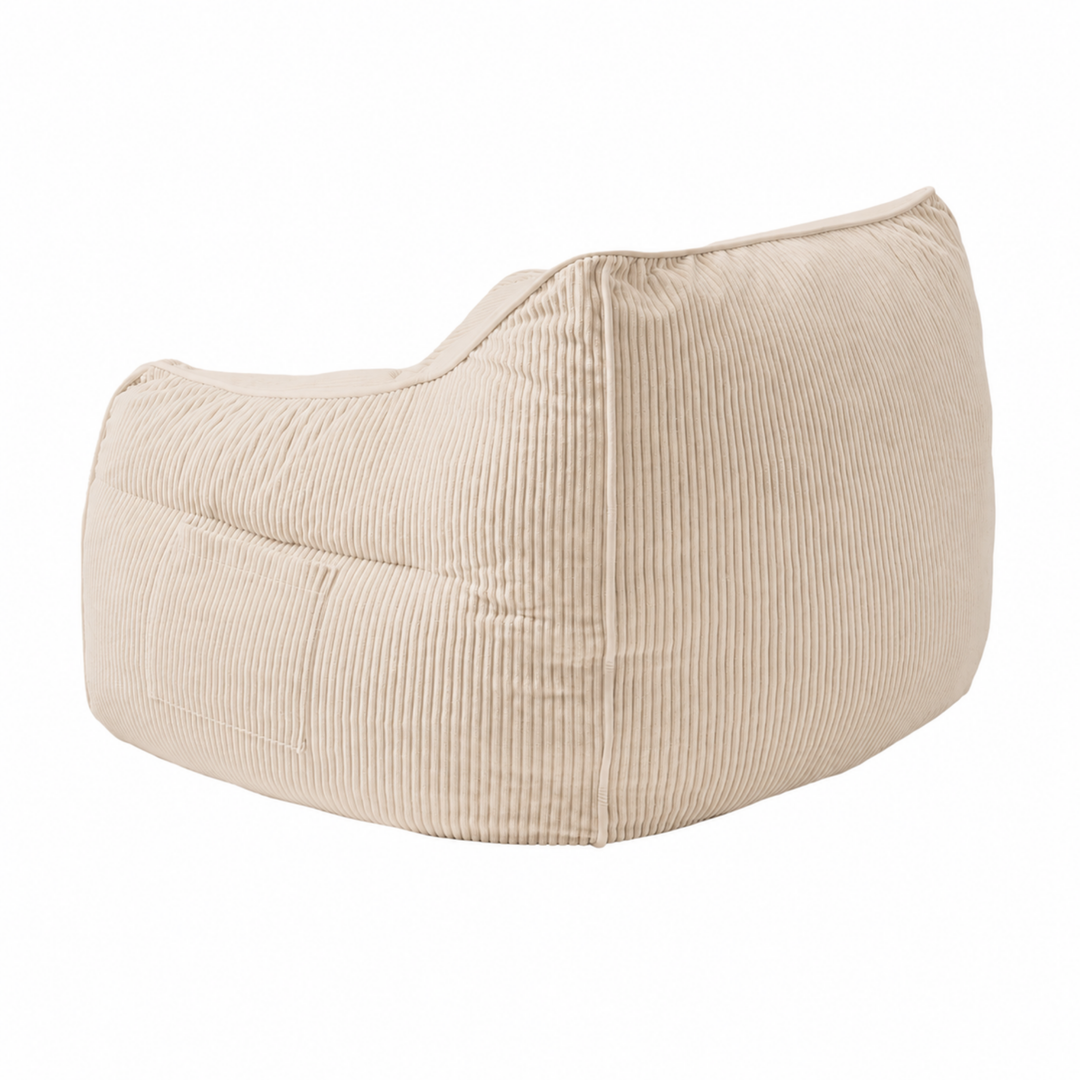 Pouf fauteuil en velours côtelé beige, vue trois-quarts