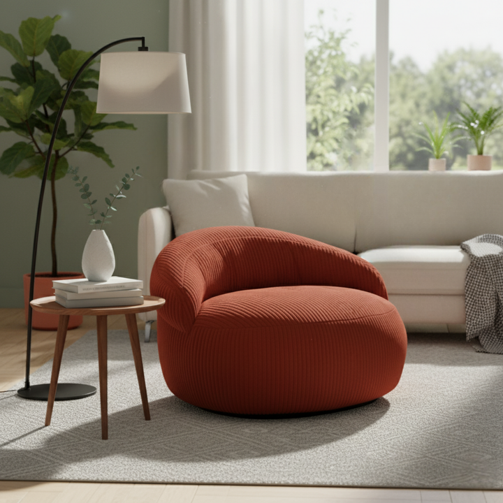 Pouf XXL déhoussable en velours côtelé, forme arrondie, dans un salon