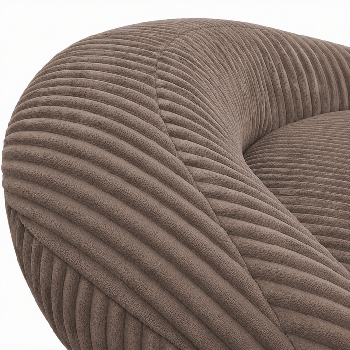 Gros plan sur le dossier arrondi du pouf XXL, tissu en velours côtelé.