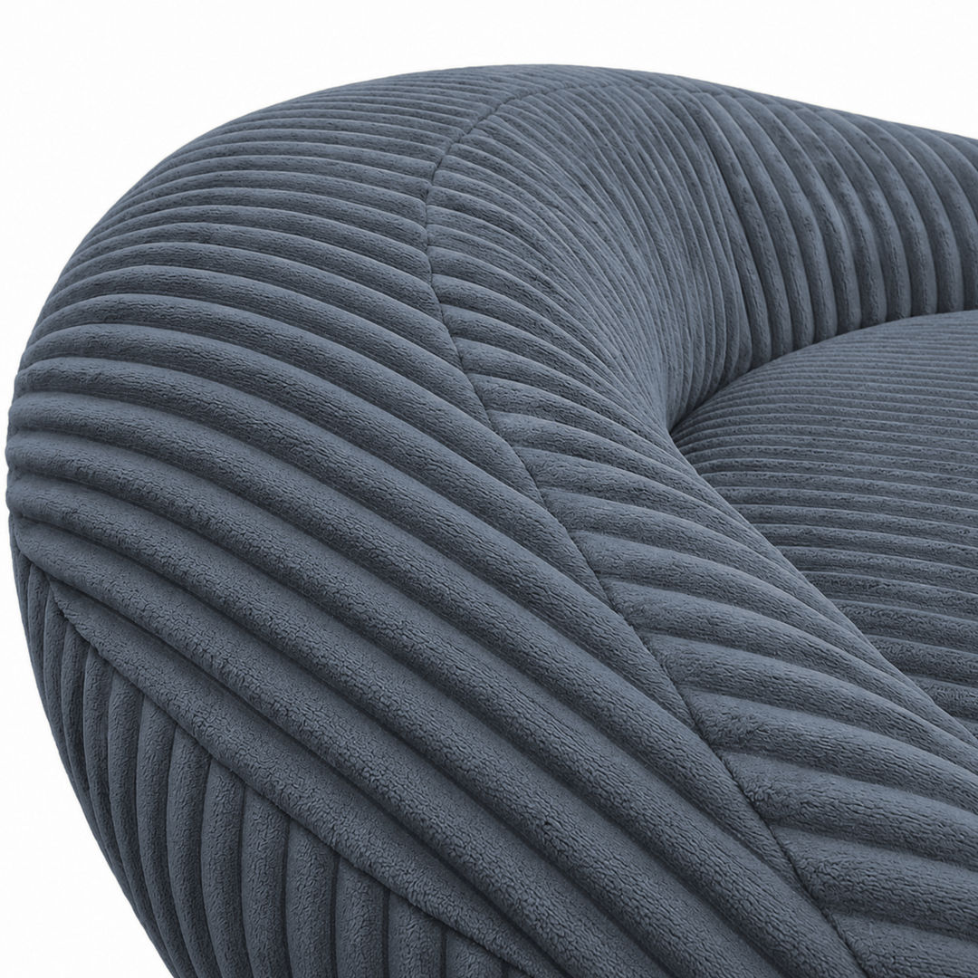 Gros plan sur le dossier arrondi du pouf XXL, tissu en velours côtelé.