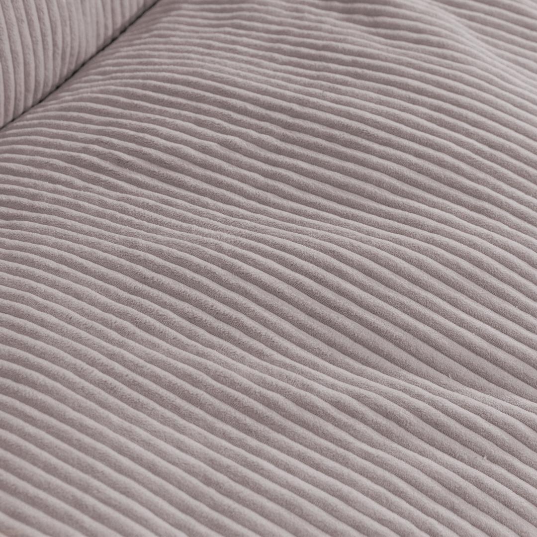 Gros plan du tissu en velours côtelé épais du pouf