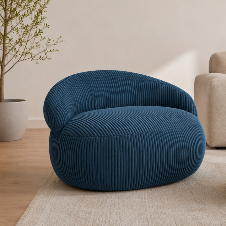 Pouf XXL déhoussable en velours côtelé, forme arrondie, dans un salon