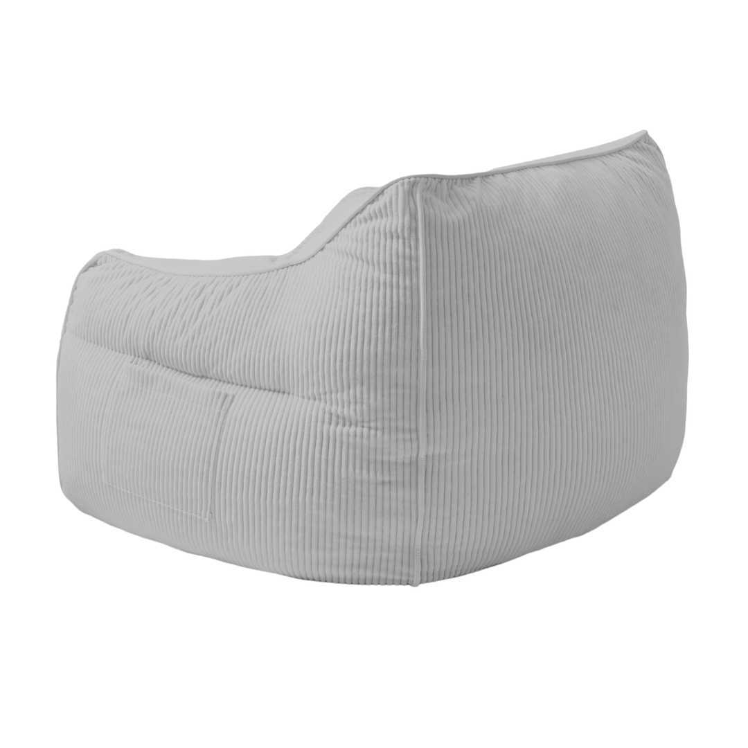 Pouf fauteuil en velours côtelé gris clair, vue trois-quarts